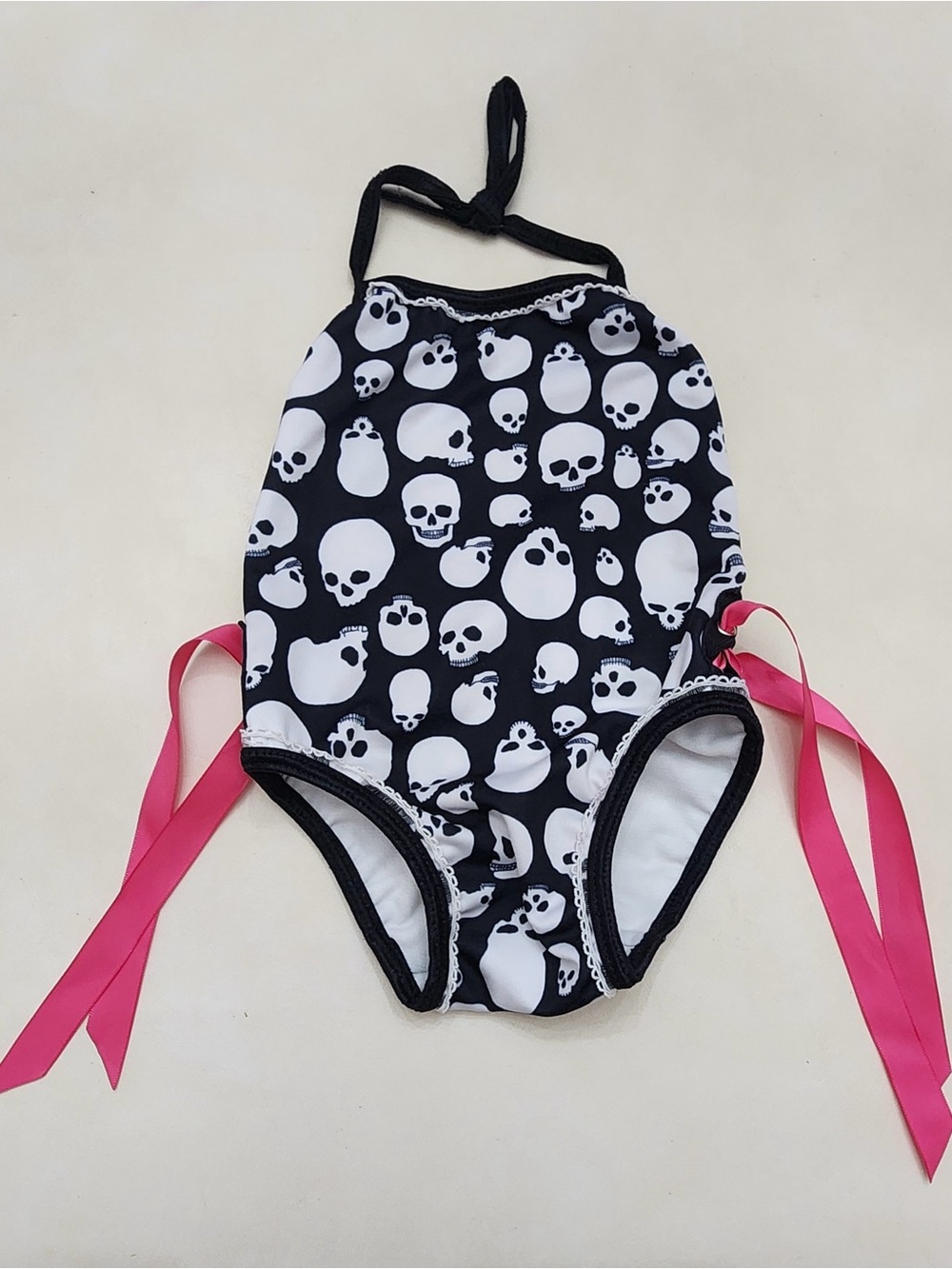 Girls Black Skull-Print One-Piece Swimsuit with Pink Side Ties